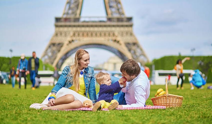 Family enjoying Eiffel Tower with kids